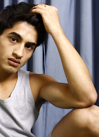 Good-looking twink posing at the studio
