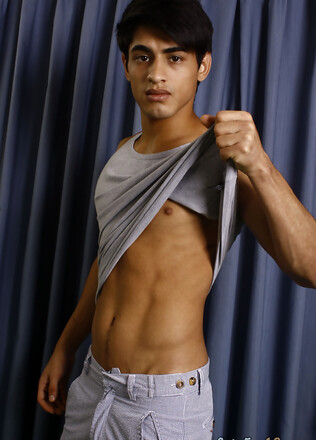 Good-looking twink posing at the studio