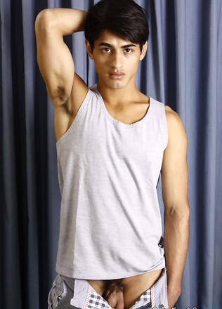 Good-looking twink posing at the studio