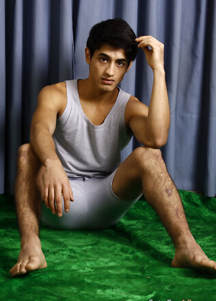 Good-looking twink posing at the studio