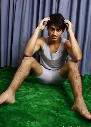 Good-looking twink posing at the studio