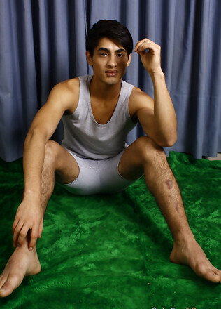 Good-looking twink posing at the studio