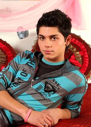 Latin twink Angelo strokes his thick cock.