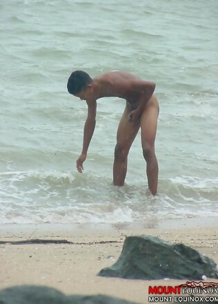 Two cute twinks at the beach sucking cock and fondling each other.